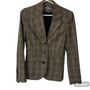 Plaid blazer which is fully lined. Button down with 2 flap faux pockets.